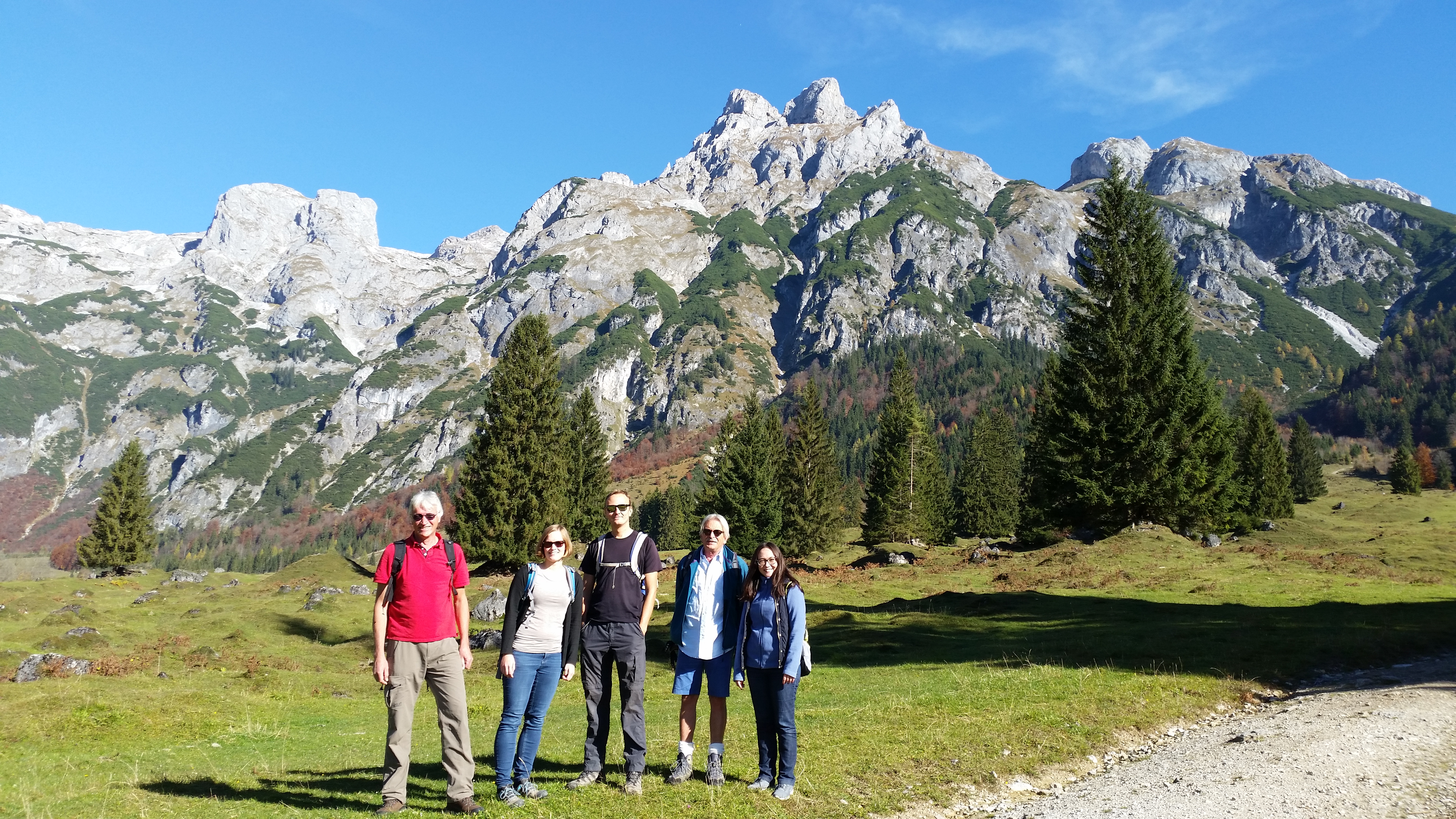 The Spatial Services team in front of an impressive mountain panorama